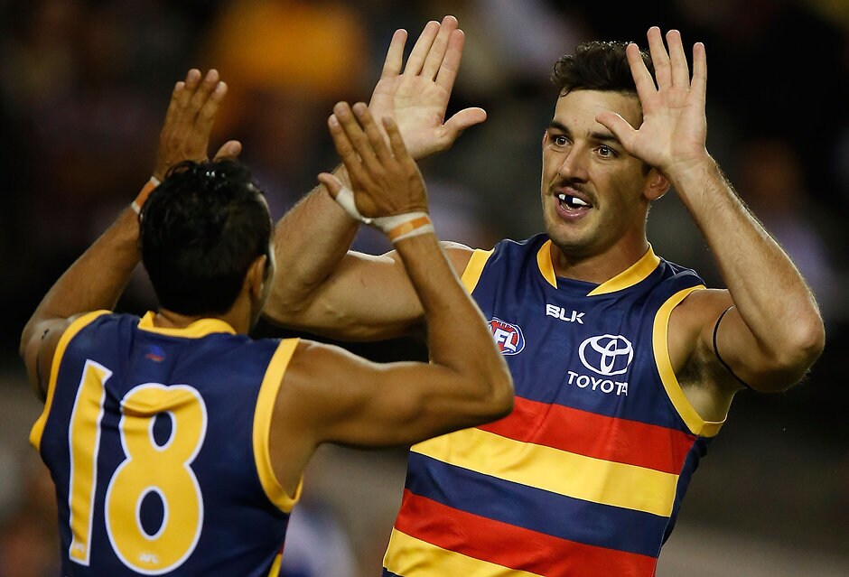 AFL 2016 Rd 01 - North Melbourne v Adelaide MELBOURNE, AUSTRALIA - MARCH 26: Eddie Betts (left) and Taylor Walker of the Crows celebrate during the 2016 AFL Round 01 match between the North Melbourne Kangaroos and the Adelaide Crows at Etihad Stadium, Melbourne on March 26, 2016. (Photo by Michael Willson/AFL Media)
